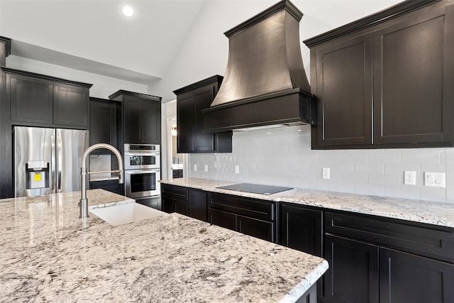 9008 Parkview Cir, Tolar, TX 76476 - kitchen featuring a sink, stainless steel appliances, tasteful backsplash, vaulted ceiling, and custom range hood