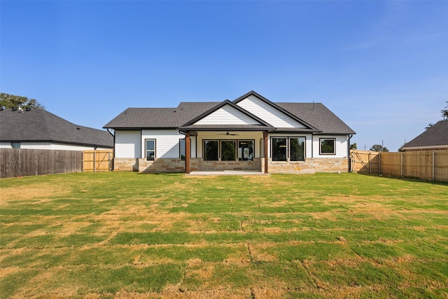 9008 Parkview Cir, Tolar, TX 76476 - back of house featuring stone siding, a patio, a fenced backyard, and ceiling fan