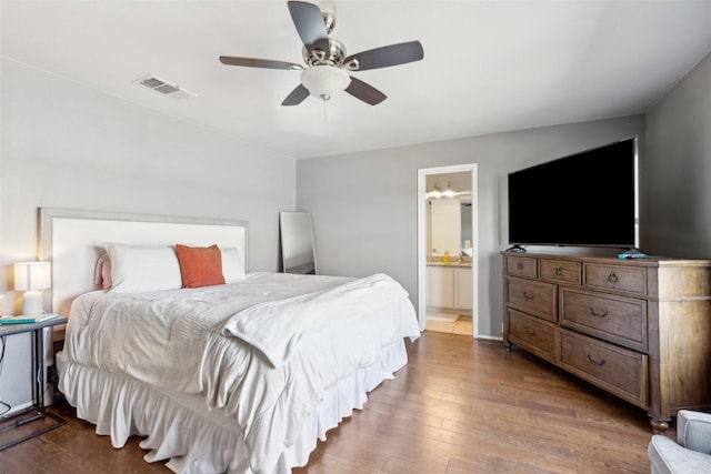 3600 Riesling Dr, Denton, TX 76226 - bedroom with a ceiling fan, ensuite bathroom, visible vents, and wood finished floors