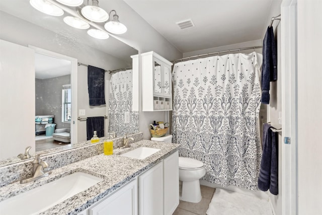 3600 Riesling Dr, Denton, TX 76226 - bathroom with toilet, visible vents, tile patterned flooring, and a sink