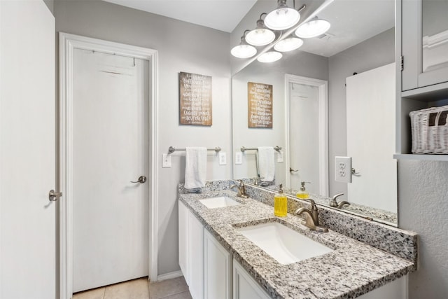 3600 Riesling Dr, Denton, TX 76226 - full bathroom with double vanity, tile patterned flooring, baseboards, and a sink