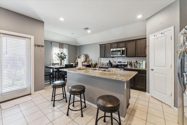 2408 Anton Dr, Forney, TX 75126 - kitchen with a sink, light tile patterned flooring, visible vents, and appliances with stainless steel finishes