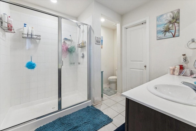2408 Anton Dr, Forney, TX 75126 - full bath featuring a stall shower, tile patterned flooring, vanity, and toilet
