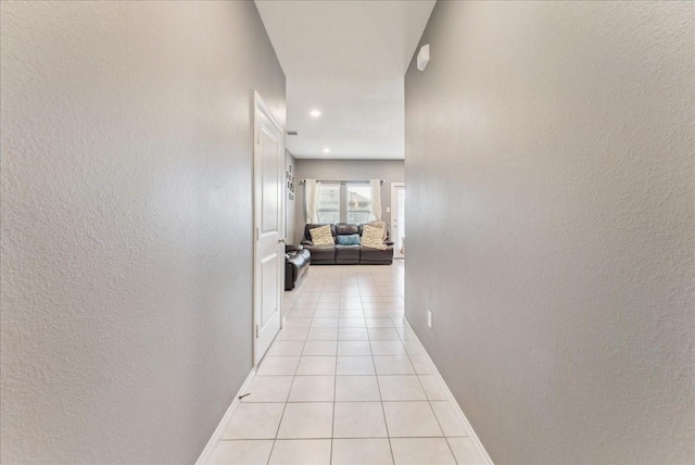 2408 Anton Dr, Forney, TX 75126 - hall with baseboards, light tile patterned flooring, and a textured wall
