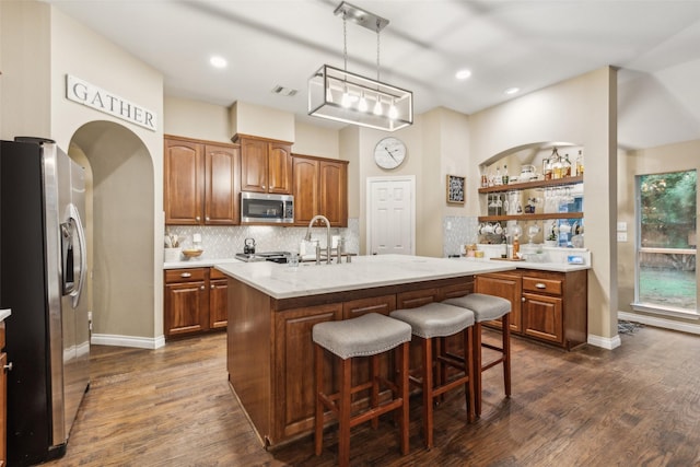 7204 Vanderbilt Dr, Mckinney, TX 75072 - kitchen featuring stainless steel appliances, a sink, dark wood-style flooring, backsplash, and recessed lighting