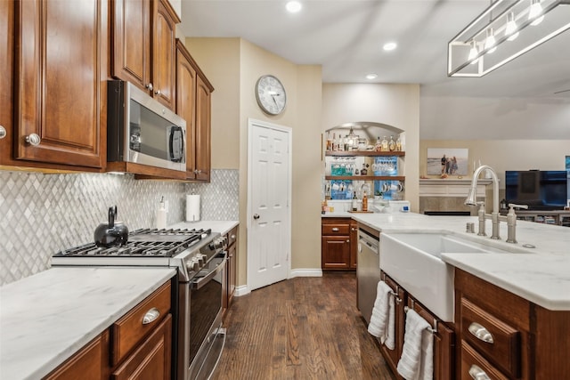 7204 Vanderbilt Dr, Mckinney, TX 75072 - kitchen featuring stainless steel appliances, a sink, dark wood-style flooring, backsplash, and light stone counters