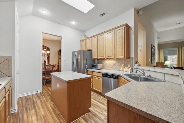 3861 Navarro Way, Frisco, TX 75034 - kitchen with an inviting chandelier, a sink, light wood-type flooring, visible vents, and appliances with stainless steel finishes