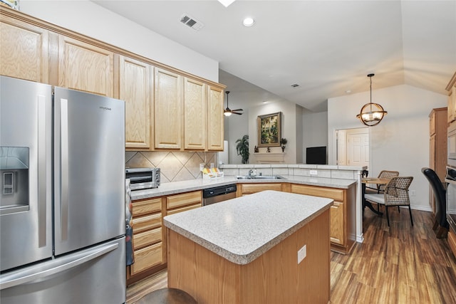 3861 Navarro Way, Frisco, TX 75034 - kitchen featuring a sink, a peninsula, stainless steel appliances, light countertops, and light brown cabinets