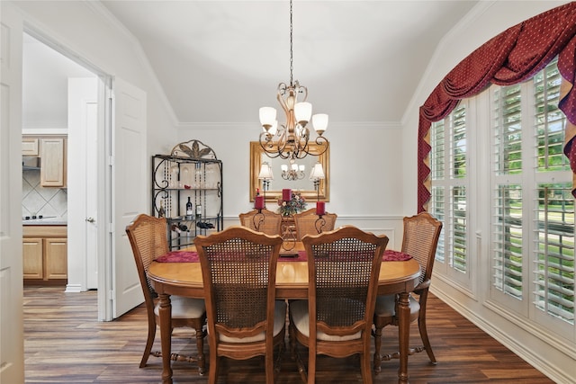 3861 Navarro Way, Frisco, TX 75034 - dining room with vaulted ceiling, ornamental molding, a notable chandelier, and dark wood-type flooring