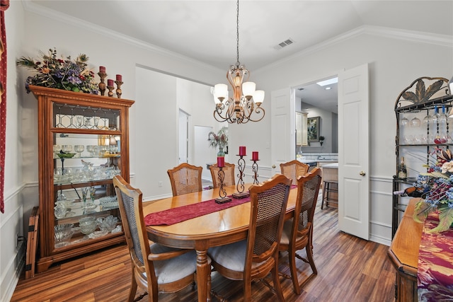 3861 Navarro Way, Frisco, TX 75034 - dining space with vaulted ceiling, crown molding, visible vents, dark wood-type flooring, and a chandelier
