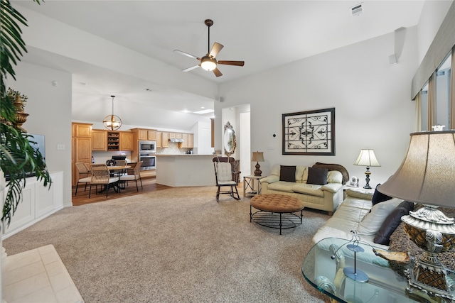 3861 Navarro Way, Frisco, TX 75034 - living area featuring lofted ceiling, ceiling fan, visible vents, and light colored carpet