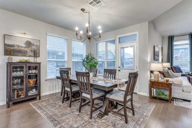 2009 Gill Star Dr, Haslet, TX 76052 - dining room with a wealth of natural light, a notable chandelier, visible vents, and wood finished floors