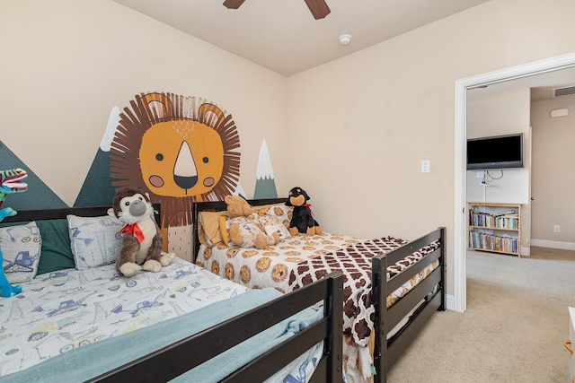 carpeted bedroom with baseboards and a ceiling fan