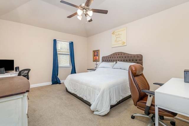 carpeted bedroom featuring a desk, baseboards, and a ceiling fan