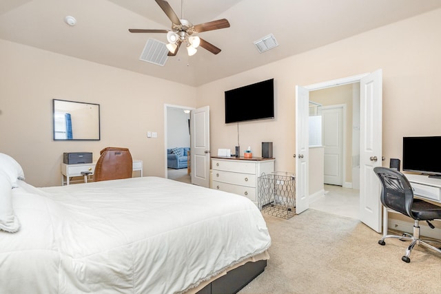 bedroom featuring light carpet, an office area, ceiling fan, and baseboards