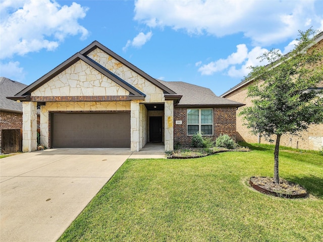 601 Bassett Hall Rd, Fate, TX 75189 - view of front of home with brick siding, stone siding, driveway, a garage, and a front yard