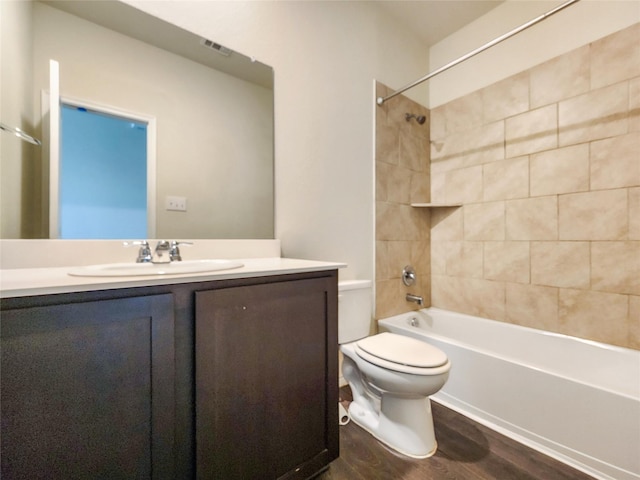 601 Bassett Hall Rd, Fate, TX 75189 - full bath featuring toilet, wood finished floors, shower / washtub combination, visible vents, and vanity