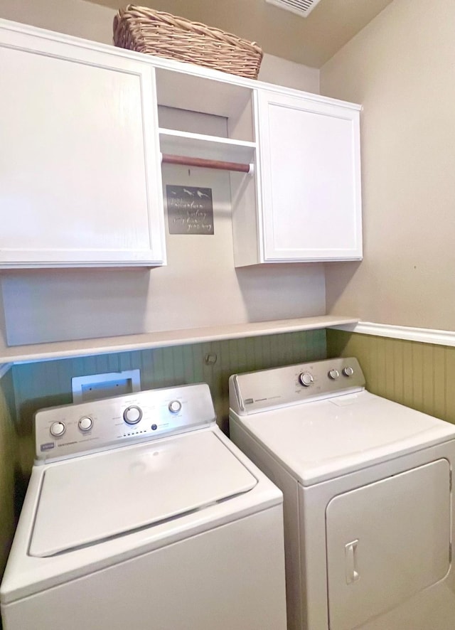 7125 Cotton Seed Dr, Mckinney, TX 75070 - washroom with washer and clothes dryer, cabinet space, and wainscoting