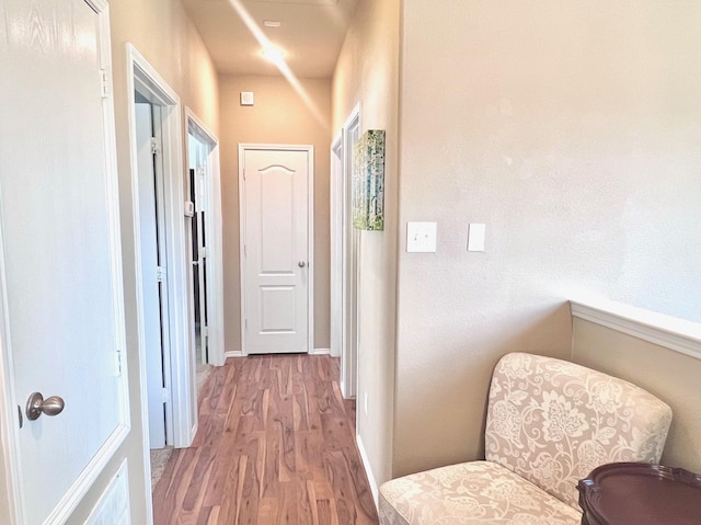 7125 Cotton Seed Dr, Mckinney, TX 75070 - corridor featuring light wood-style flooring and baseboards