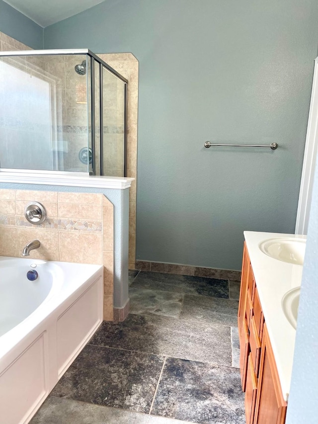 7125 Cotton Seed Dr, Mckinney, TX 75070 - full bath with a garden tub, a stall shower, double vanity, stone finish floors, and baseboards