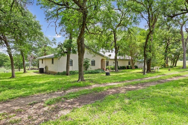 502 First St, Bruceville, TX 76630 - view of green lawn with cooling unit
