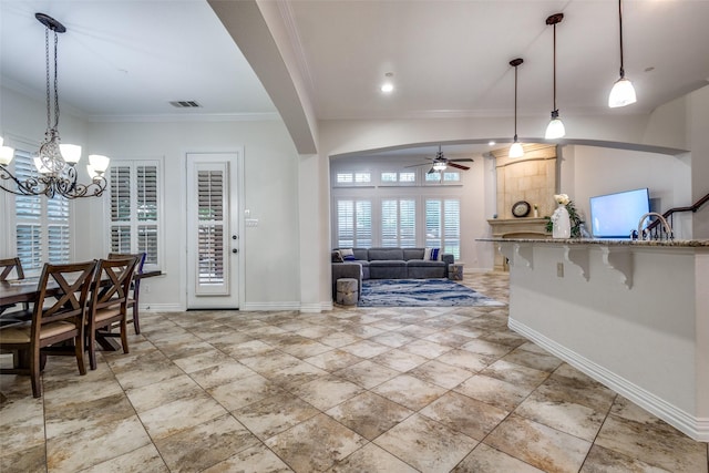 2204 Aberdeen Dr, Trophy Club, TX 76262 - dining area with a ceiling fan, crown molding, a chandelier, and baseboards