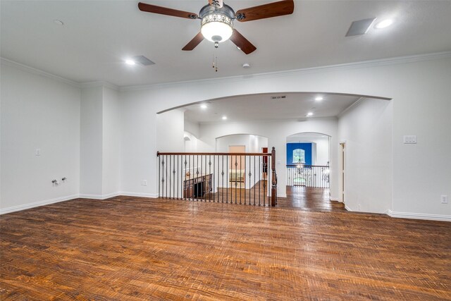 2204 Aberdeen Dr, Trophy Club, TX 76262 - unfurnished room with ceiling fan, arched walkways, wood finished floors, crown molding, and baseboards