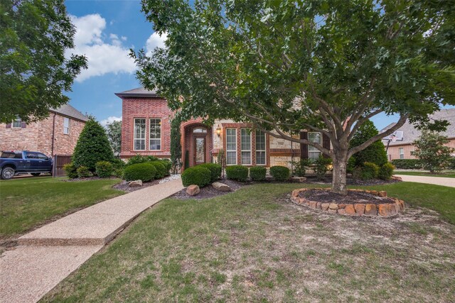 2204 Aberdeen Dr, Trophy Club, TX 76262 - view of property hidden behind natural elements with brick siding and a front yard