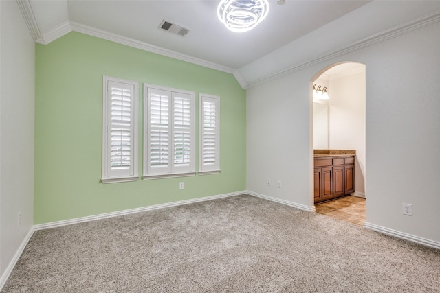 2204 Aberdeen Dr, Trophy Club, TX 76262 - spare room featuring ornamental molding, arched walkways, light carpet, and baseboards