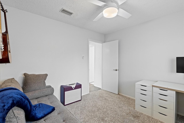 living area featuring carpet floors, a ceiling fan, and baseboards