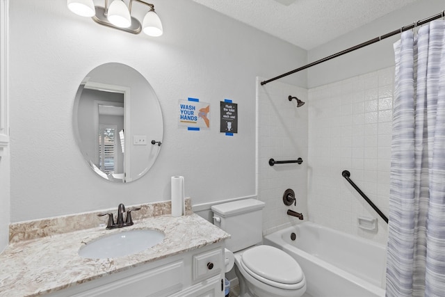 full bathroom with vanity, shower / tub combo, toilet, and a textured ceiling