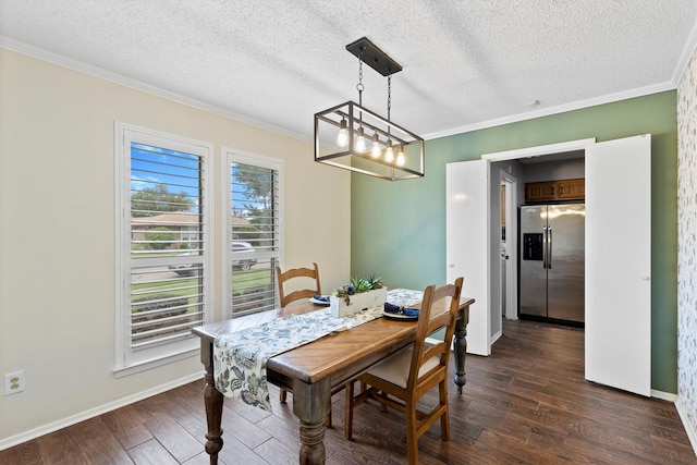 dining area featuring ornamental molding, dark wood finished floors, a textured ceiling, baseboards, and a chandelier
