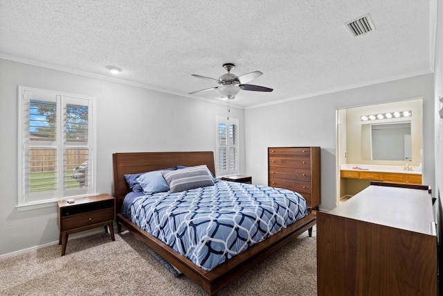 bedroom featuring crown molding, light colored carpet, a textured ceiling, a ceiling fan, and baseboards