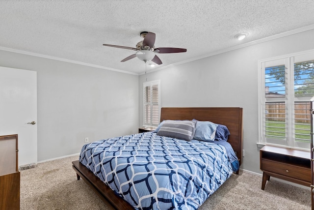 bedroom featuring carpet flooring, ornamental molding, a textured ceiling, baseboards, and a ceiling fan