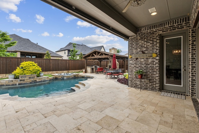 view of swimming pool featuring a gazebo, a patio area, a fenced backyard, and a pool with connected hot tub