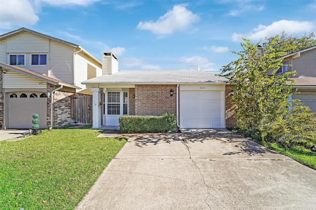 5020 Palo Alto Dr, Garland, TX 75043 - view of front of property with an attached garage, driveway, brick siding, a chimney, and a shingled roof
