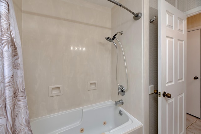 bathroom featuring a combined bath / shower with jetted tub and tile patterned floors