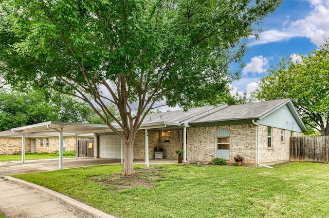 ranch-style house featuring a garage, brick siding, driveway, and an attached carport