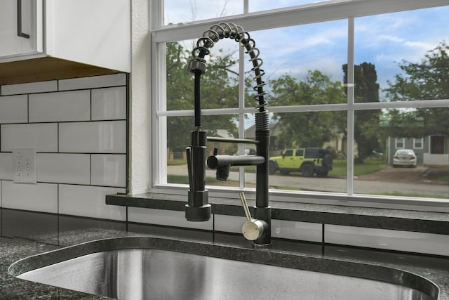 1110 Green St, Abilene, TX 79603 - kitchen view of dark countertops and white cabinets