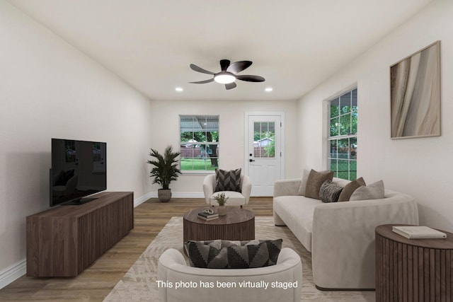 1110 Green St, Abilene, TX 79603 - living room with light wood-style flooring, a ceiling fan, baseboards, and recessed lighting