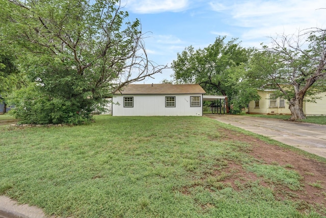 1110 Green St, Abilene, TX 79603 - view of front of house with a front yard, driveway, and a carport