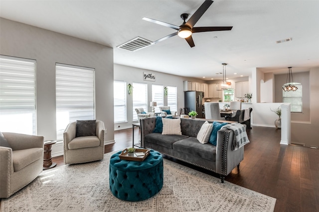 living room featuring wood finished floors, ceiling fan, baseboards, and recessed lighting