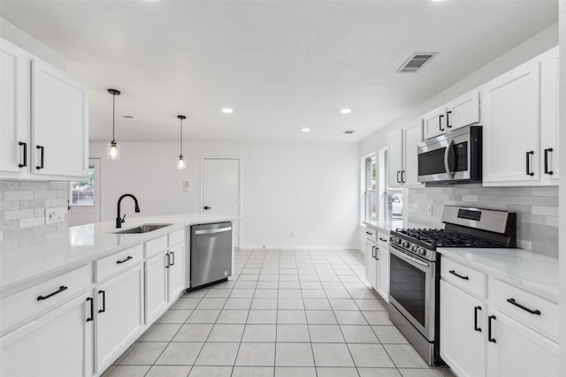 1411 Thistle Cir, Allen, TX 75002 - kitchen featuring stainless steel appliances, a sink, decorative backsplash, light countertops, and white cabinetry