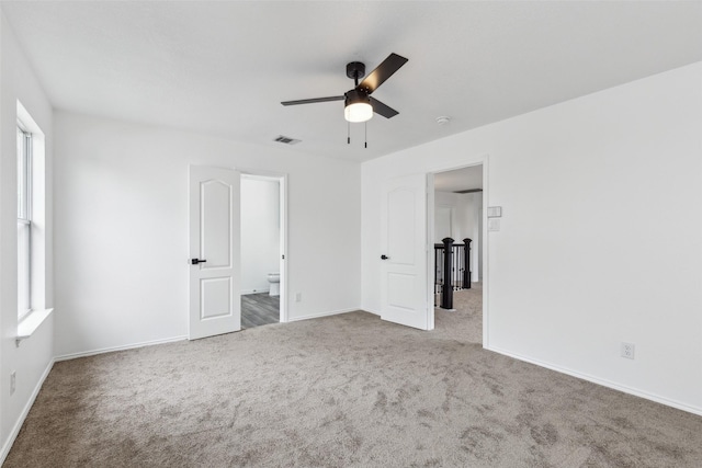 1411 Thistle Cir, Allen, TX 75002 - unfurnished bedroom featuring carpet floors, baseboards, connected bathroom, and a ceiling fan