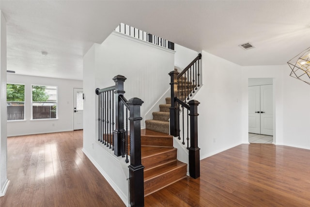 1411 Thistle Cir, Allen, TX 75002 - staircase with wood finished floors and baseboards