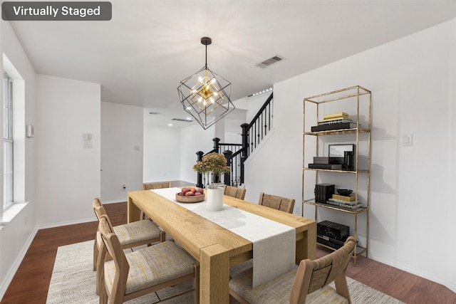 1411 Thistle Cir, Allen, TX 75002 - dining room with stairs, a chandelier, dark wood-style floors, and baseboards