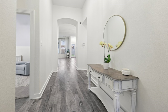 1405 Chickadee Dr, Argyle, TX 76226 - hall with arched walkways, dark wood-style flooring, and baseboards