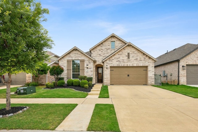 1405 Chickadee Dr, Argyle, TX 76226 - view of front of home featuring driveway, a front lawn, and brick siding
