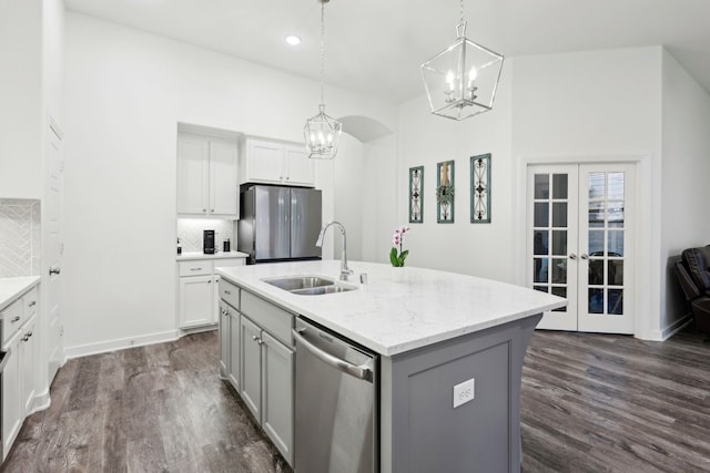 1405 Chickadee Dr, Argyle, TX 76226 - kitchen with appliances with stainless steel finishes, a sink, a chandelier, french doors, and gray cabinets
