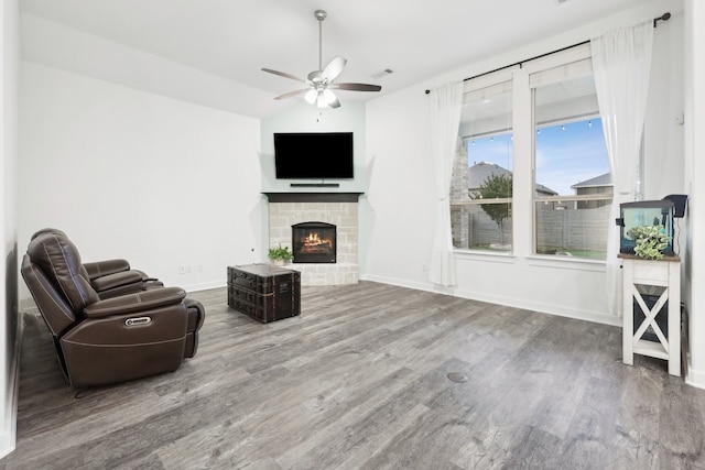 1405 Chickadee Dr, Argyle, TX 76226 - unfurnished living room with ceiling fan, a lit fireplace, wood finished floors, baseboards, and lofted ceiling